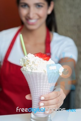 Pretty Girl Serving Strawberry Shake Stock Photo