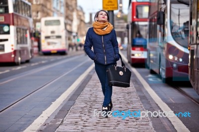 Pretty Girl Walking On The Road Stock Photo