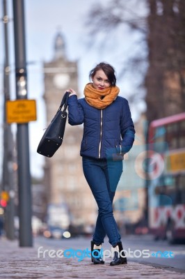 Pretty Girl Walking On The Road Stock Photo