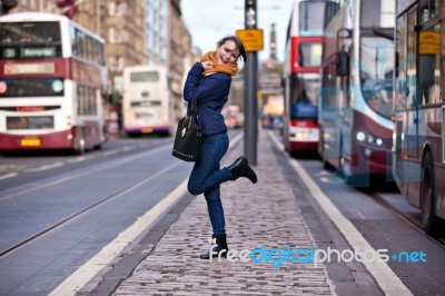 Pretty Girl Walking On The Road Stock Photo