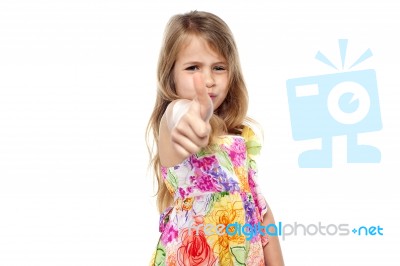 Pretty Kid Showing Thumbs Up Stock Photo