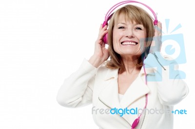 Pretty Lady Enjoying Rock Music Stock Photo