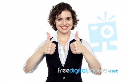 Pretty Lady Gesturing Double Thumbs Up Stock Photo