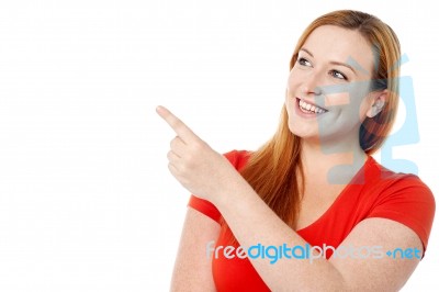 Pretty Lady Pointing At Something Stock Photo