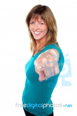 Pretty Lady Pointing Towards You Stock Photo