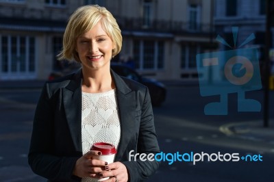 Pretty Lady Posing In The Middle Of The Street Stock Photo