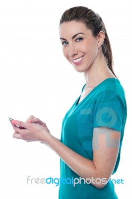 Pretty Lady Sending Text Message Stock Photo