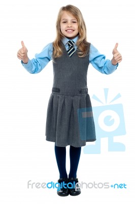 Pretty School Child Showing Thumbs Up Gesture Stock Photo