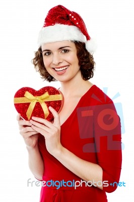 Pretty Smiling Santa Woman With Christmas Gift Stock Photo