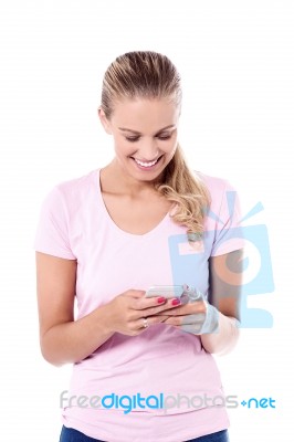 Pretty Smiling Woman Using Smartphone Stock Photo