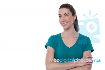 Pretty Smiling Woman With Arms Crossed Stock Photo