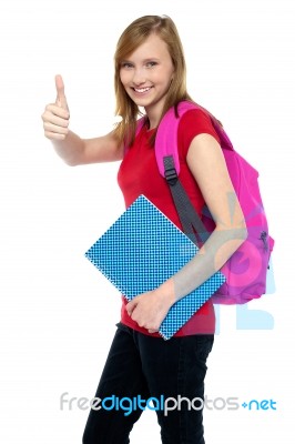 Pretty University Student Showing Thumbs Up Sign Stock Photo