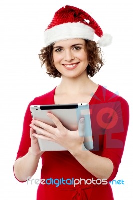 Pretty Woman Browsing Her Tablet Pc Stock Photo