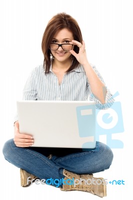 Pretty Woman Browsing On Laptop Stock Photo