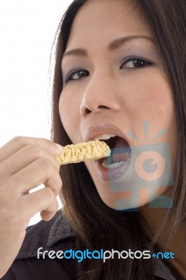 Pretty Woman Eating Cookies Stock Photo