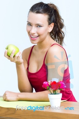 Pretty Woman Eating One Green Apple Stock Photo