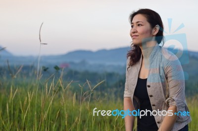 Pretty Woman Enjoying Nature Stock Photo