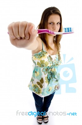 Pretty Woman Holding Brush Stock Photo