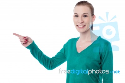 Pretty Woman Pointing Away Stock Photo