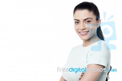 Pretty Woman Posing With Folded Arms Stock Photo