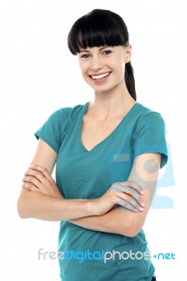 Pretty Woman Posing With Her Arms Crossed Stock Photo