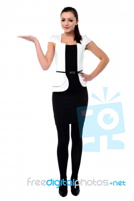 Pretty Woman Presenting Something Stock Photo