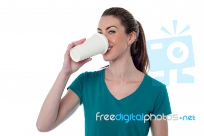 Pretty Woman Sipping Beverage Stock Photo