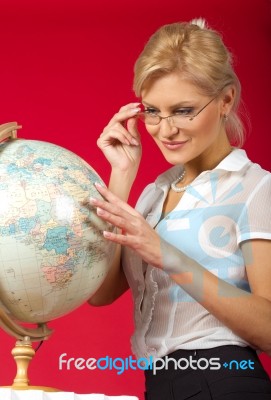 Pretty Woman Teacher With Globe Stock Photo