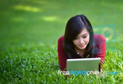 Pretty Woman Using Tablet Stock Photo