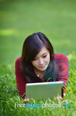 Pretty Woman Using Tablet Stock Photo