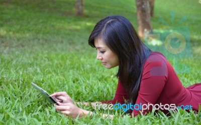 Pretty Woman Using Tablet Stock Photo