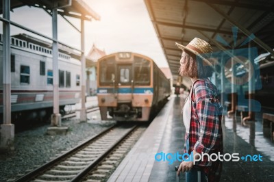 Pretty Woman Waiting The Train At Train Station For Travel In Su… Stock Photo