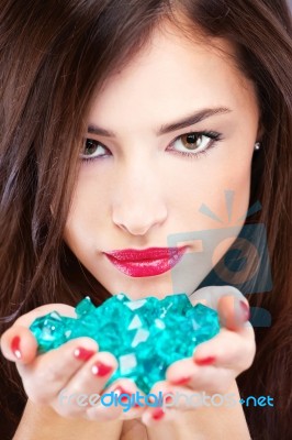 Pretty Woman With Blue Rocks Stock Photo