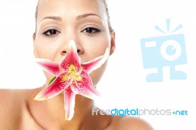 Pretty Woman With Lily Flower In Mouth Stock Photo