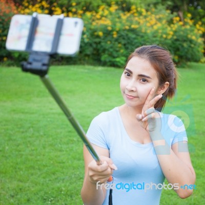 Pretty Young Female Tourist Takes Travel Selfie Stock Photo