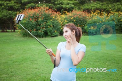 Pretty Young Female Tourist Takes Travel Selfie Stock Photo