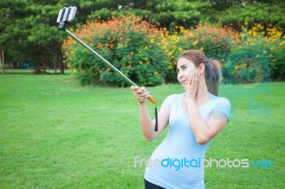 Pretty Young Female Tourist Takes Travel Selfie Stock Photo