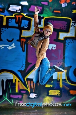 Pretty Young Girl And Graffiti Stock Photo