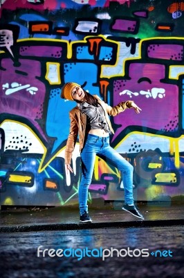 Pretty Young Girl And Graffiti Stock Photo