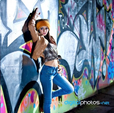 Pretty Young Girl And Graffiti Stock Photo