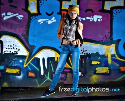 Pretty Young Girl And Graffiti Stock Photo