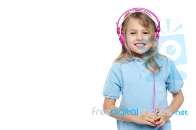 Pretty Young Girl Enjoying Music Stock Photo