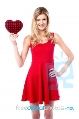 Pretty Young Girl Holding Heart Shaped Gift Stock Photo