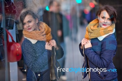 Pretty Young Girl Standing At Shopfront Stock Photo