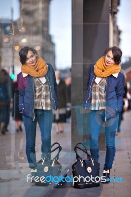 Pretty Young Girl Standing At Shopfront Stock Photo