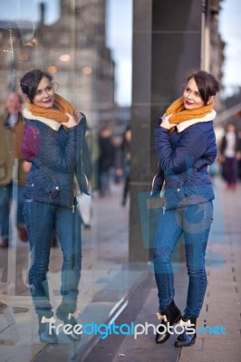 Pretty Young Girl Standing At Shopfront Stock Photo