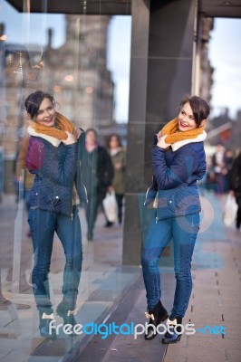 Pretty Young Girl Standing At Shopfront Stock Photo