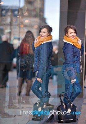 Pretty Young Girl Standing At Shopfront Stock Photo