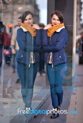 Pretty Young Girl Standing At Shopfront Stock Photo