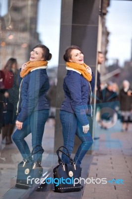 Pretty Young Girl Standing At Shopfront Stock Photo